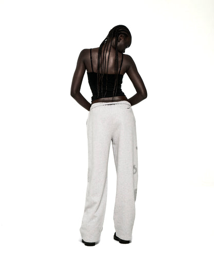 Light grey wide-leg sweatpants with rhinestone 'SP5DER' text, '5', and star designs.