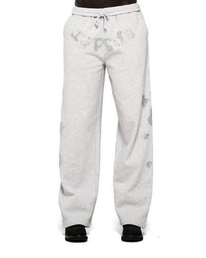 Light gray wide-leg sweatpants with rhinestone "SP5DER" text at crotch and "5" and star designs.