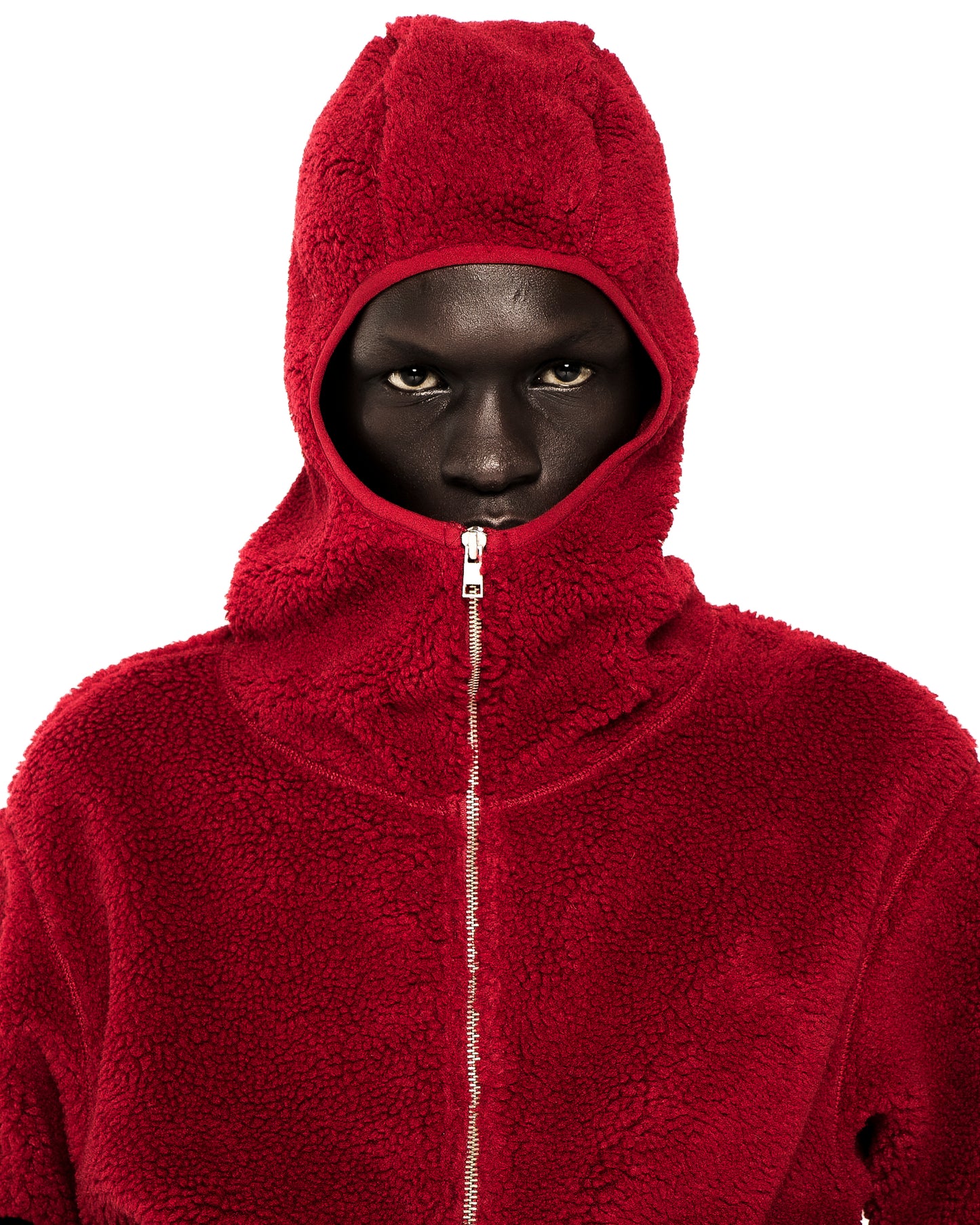 Red sherpa fleece hooded zip-up jacket with a narrow front opening and silver zipper.