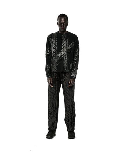 Black waffle knit thermal shirt and pants with all-over tire track print.