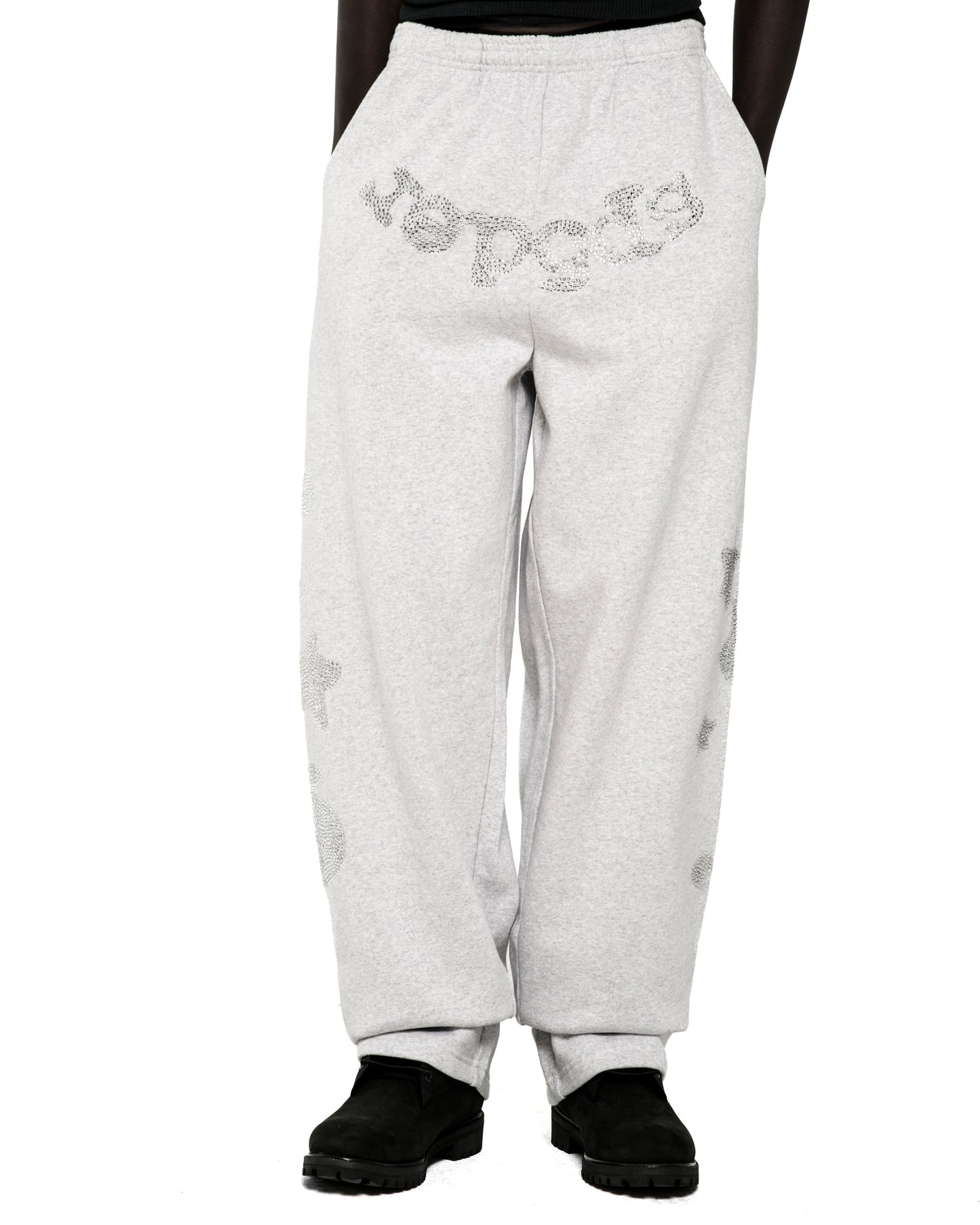 Light grey wide-leg sweatpants with rhinestone "SP5DER" text at crotch and "5" and star designs.