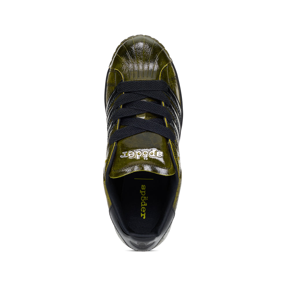 SP5DER x ADIDAS SUPERSTAR sneaker, top-down view. Glossy cracked olive patent leather, black laces, and "sp5der" branding.