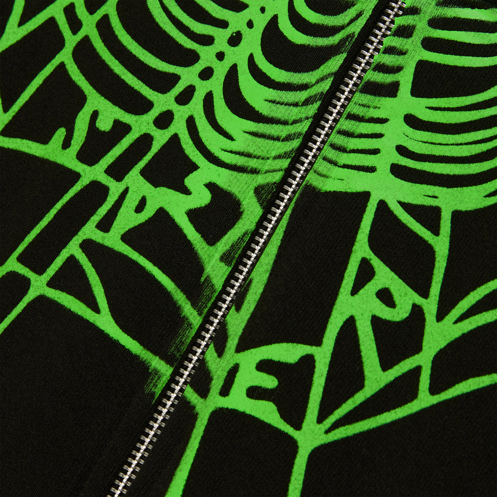 Black cotton fleece hoodie with neon green phantom web print, rhinestones, and silver zip closure.