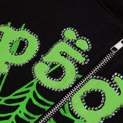 Black cotton fleece hoodie with green puff print and rhinestone "OG" lettering, featuring a silver zipper.