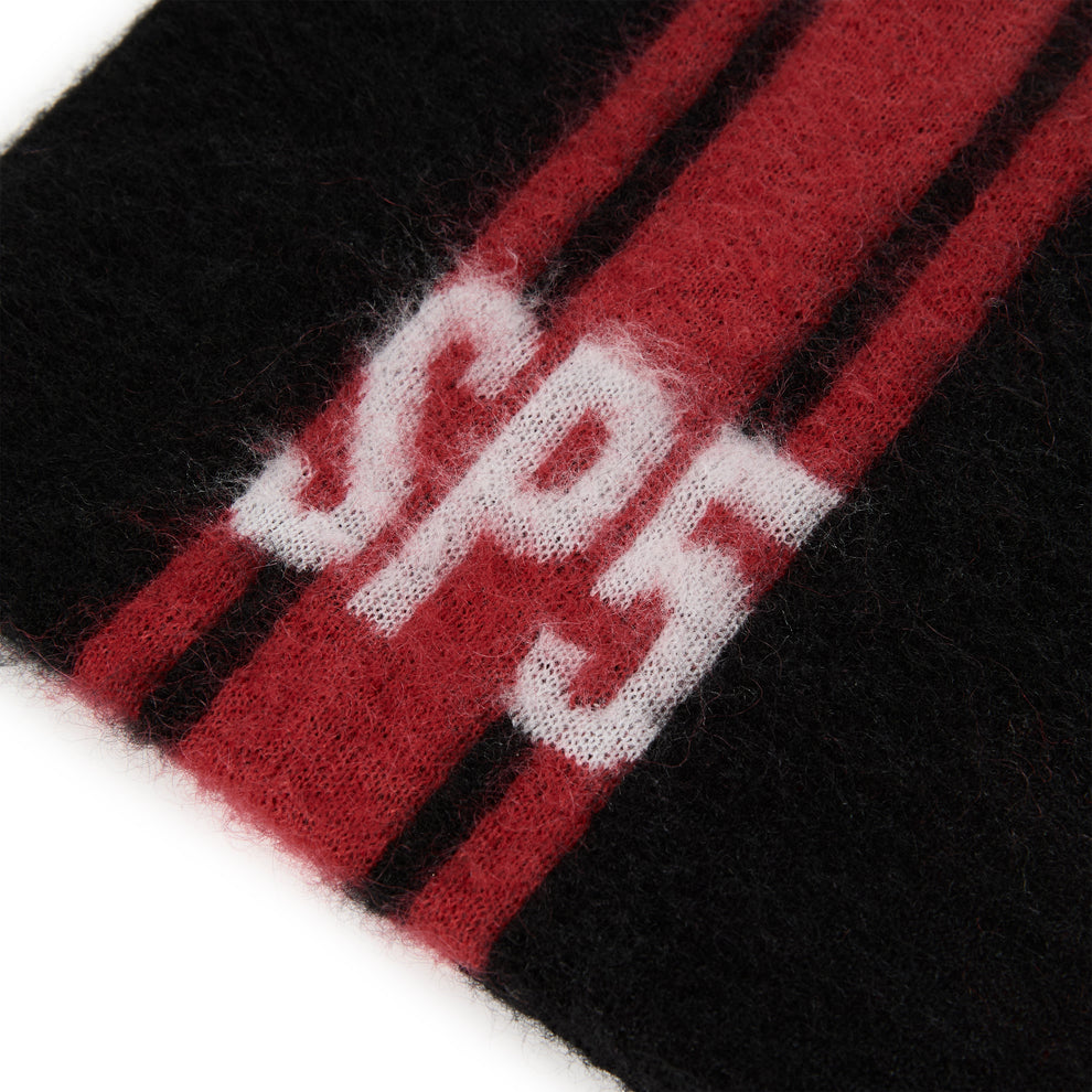 Black mohair knit beanie with red vertical stripes and a white "SP5" logo.