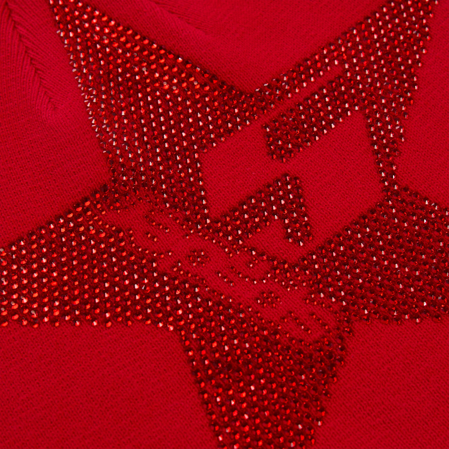 Red acrylic skully with a large, sparkly red rhinestone 5-star design.