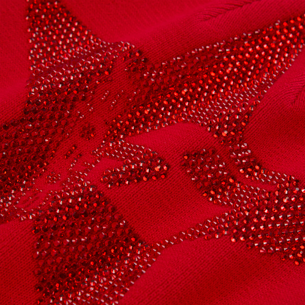 Red acrylic beanie with a large, sparkling rhinestone 5-star design.