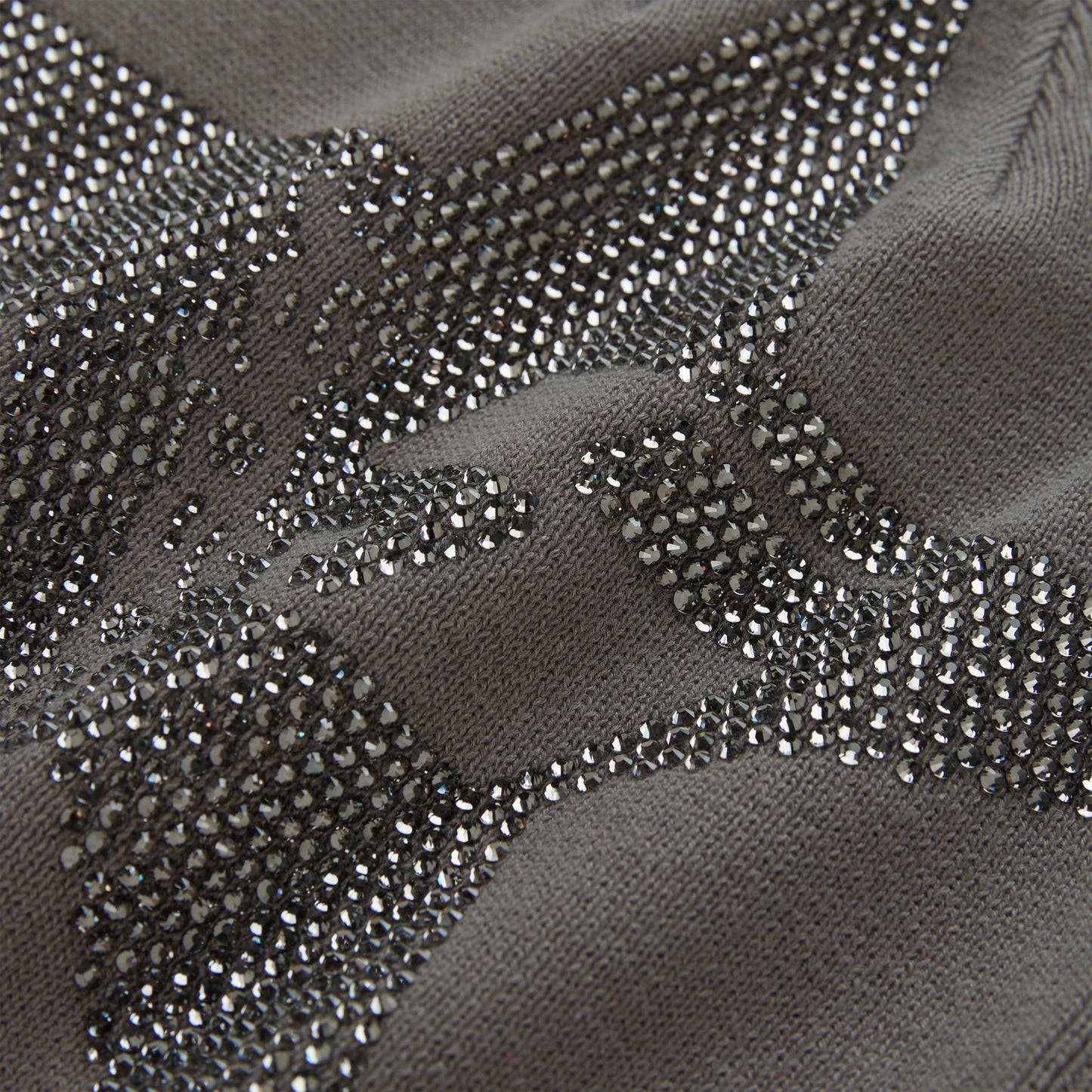 Gray acrylic skully with a sparkling rhinestone 5-star design.