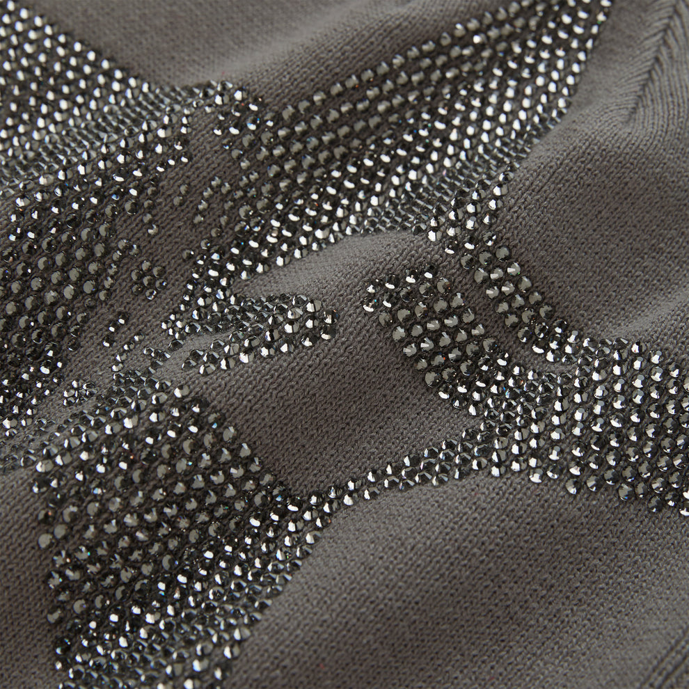 Gray acrylic skully with a sparkling rhinestone 5-star design.