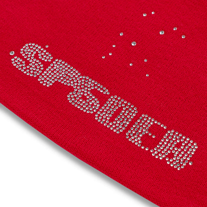 Red acrylic skully with "SPIDER" spelled out in rhinestones, plus scattered rhinestones.