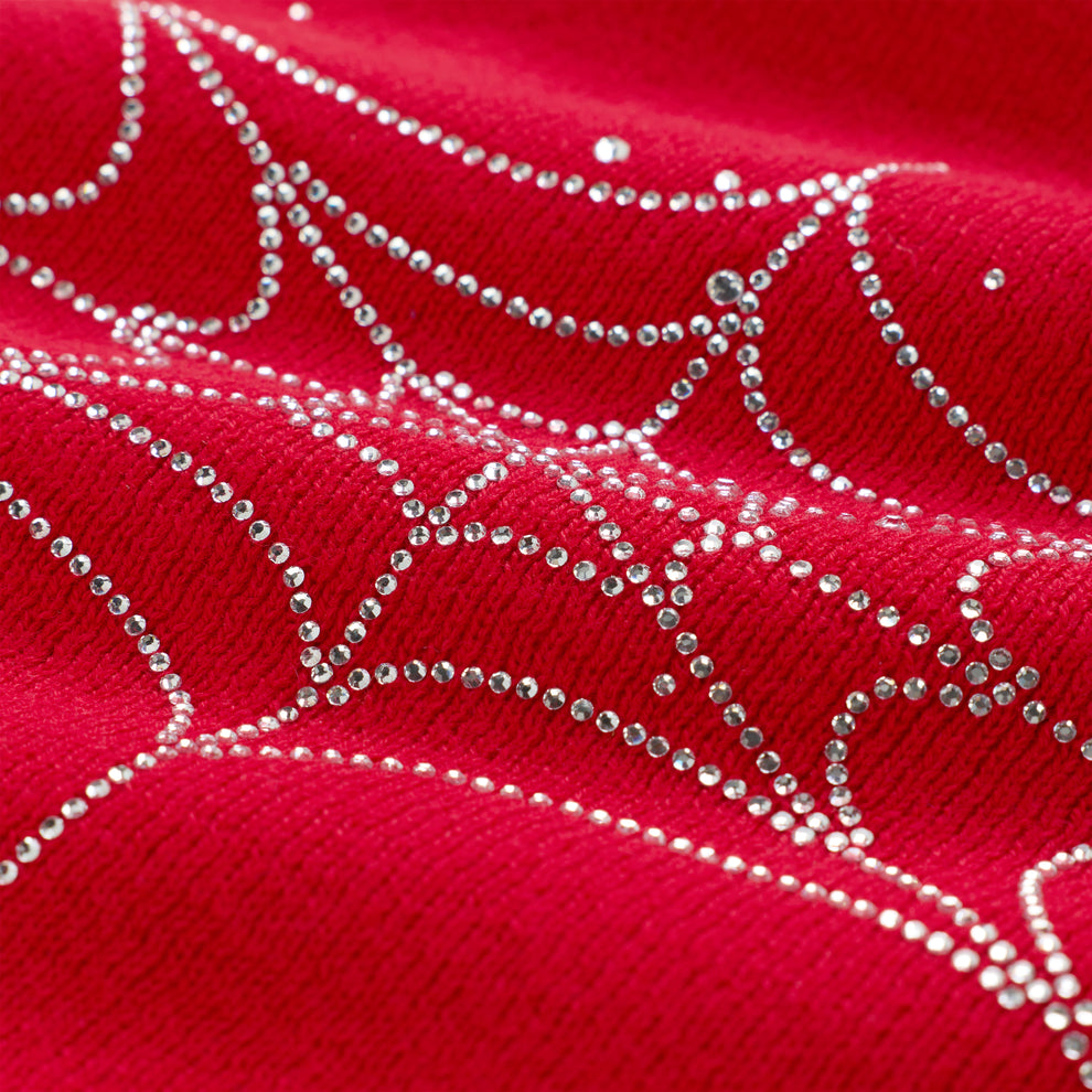 Red acrylic skully with sparkling rhinestone spiderweb design.