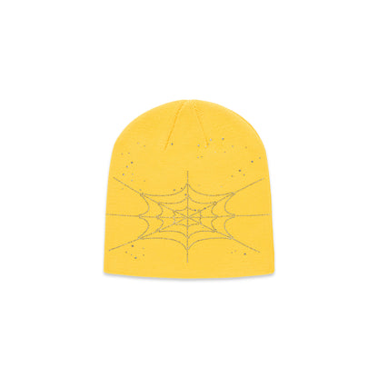 Yellow acrylic beanie with a rhinestone spiderweb design.