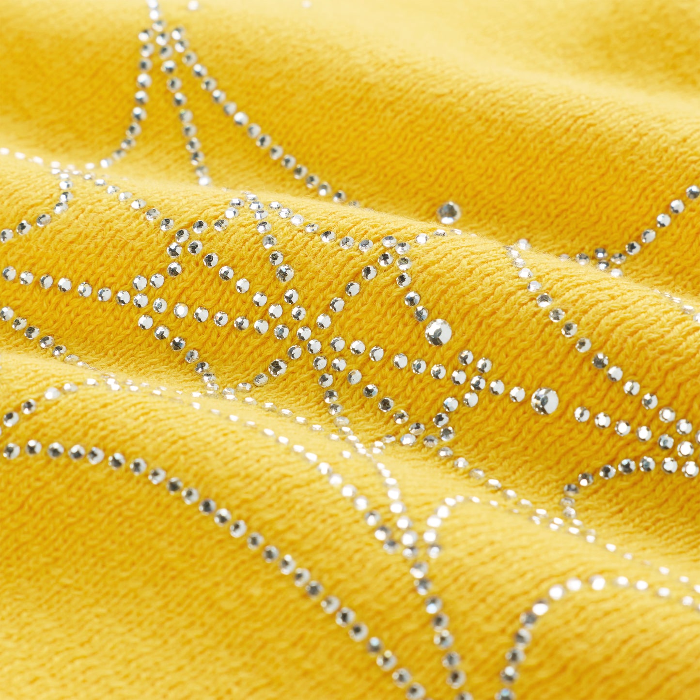 Yellow acrylic skully with rhinestone skull and spiderweb design.