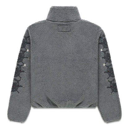 Gray sherpa fleece zip-up jacket with stand collar, web print, and rhinestone sleeves.