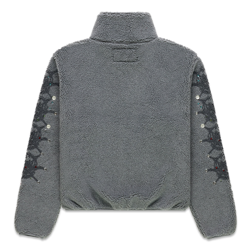 Gray sherpa fleece zip-up jacket with stand collar, web print, and rhinestone sleeves.