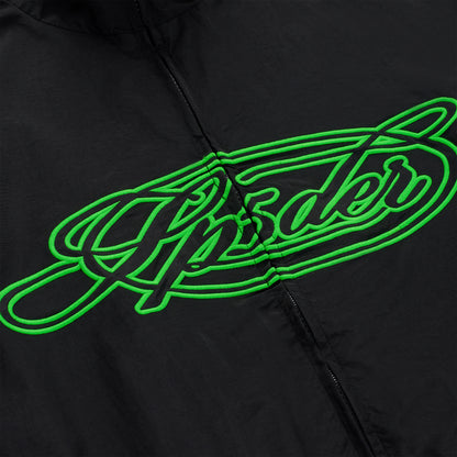 Black nylon track jacket with a prominent green embroidered "Sp5der" script logo on the chest.