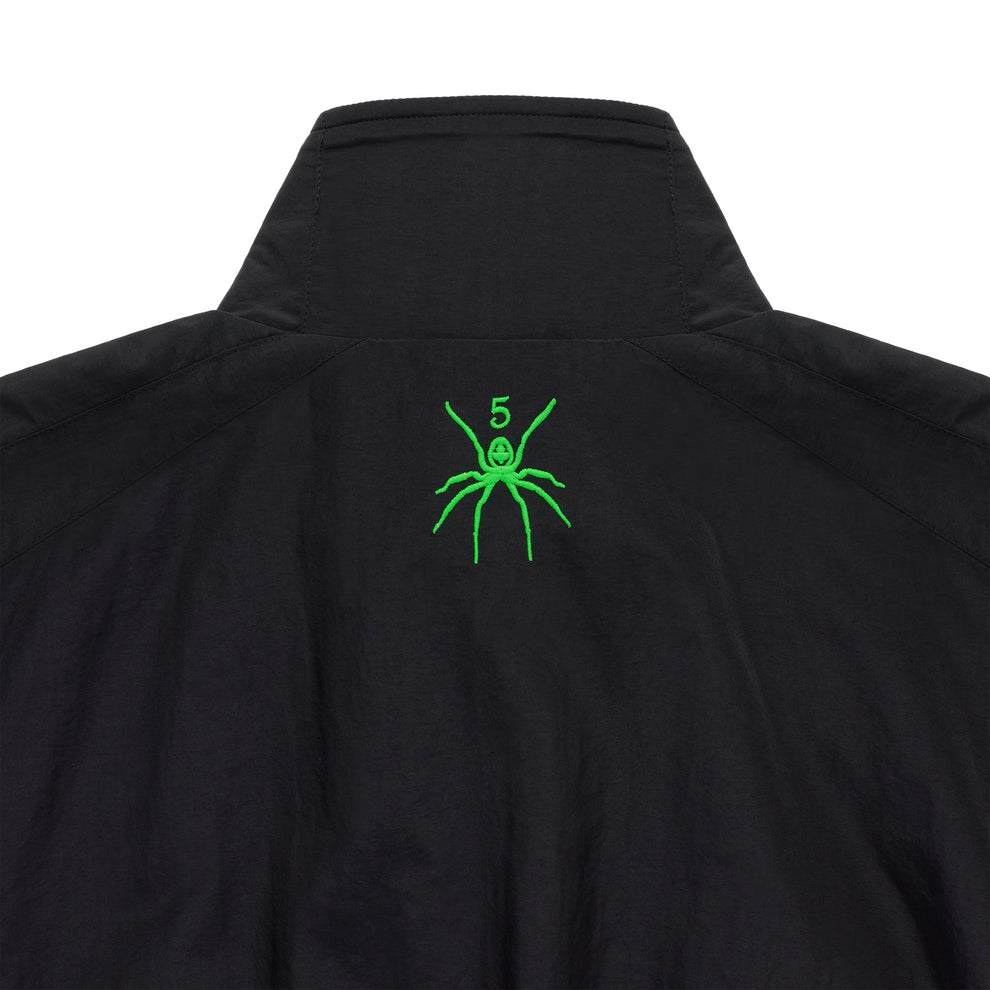 Black nylon track jacket with green embroidered spider logo and "5" on the back neck.
