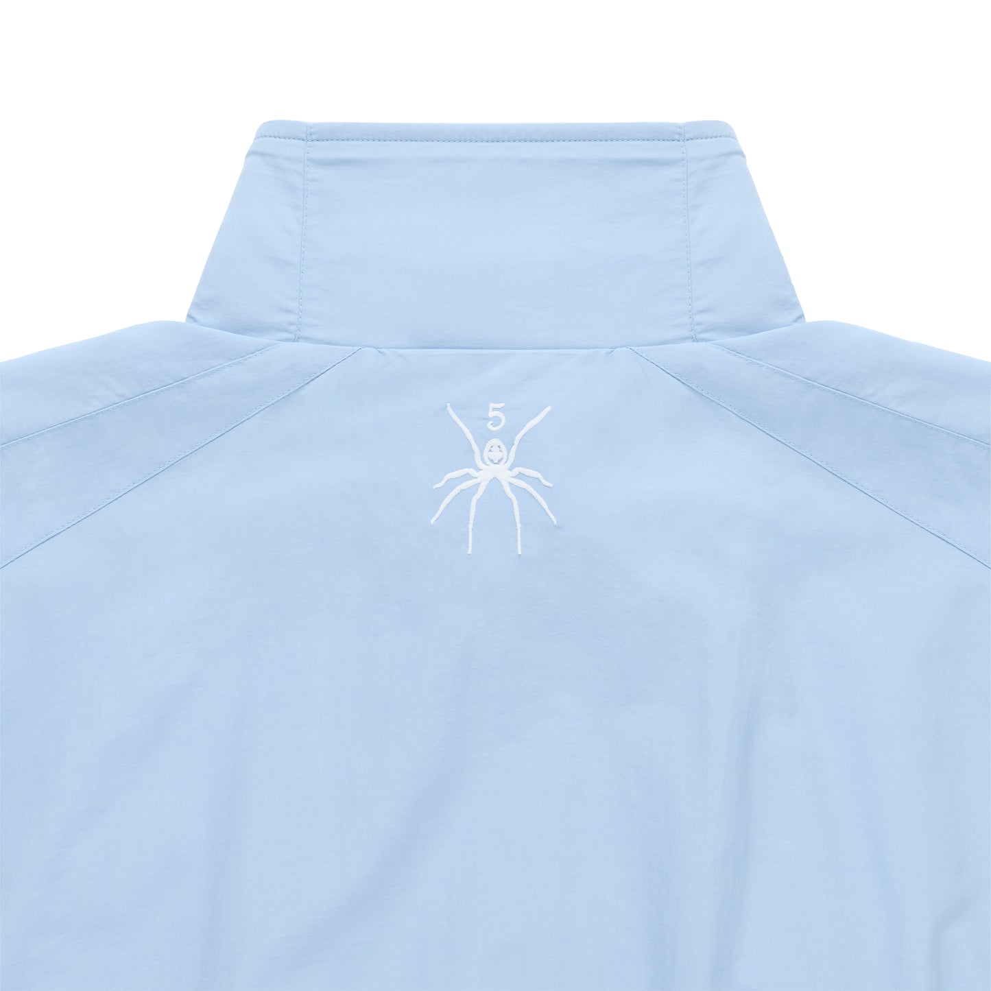 Light blue nylon track jacket with stand collar, white embroidered spider logo, and "5" on the back neck.