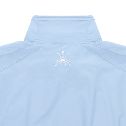 Light blue nylon track jacket with stand collar, white embroidered spider logo, and "5" on the back neck.