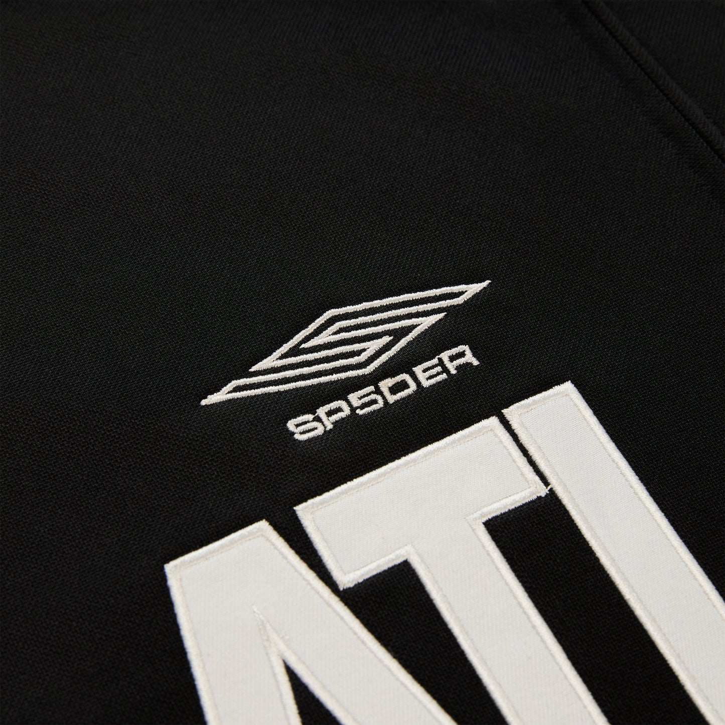Black polyester Atlanta Track Jacket with white SP5DER logo and "ATL" lettering.