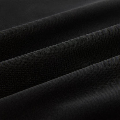 Close-up of black athletic polyester fabric with subtle texture and soft folds.