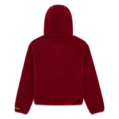 Back view of a red sherpa fleece hooded zip-up jacket with a rubberized logo patch on the wrist.