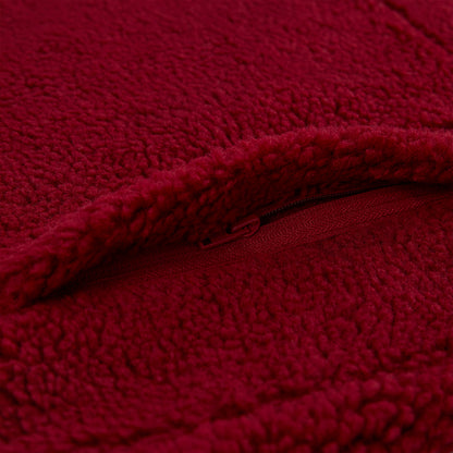 Close-up of a red teddy sherpa fleece zip-up jacket with a matching zipper.