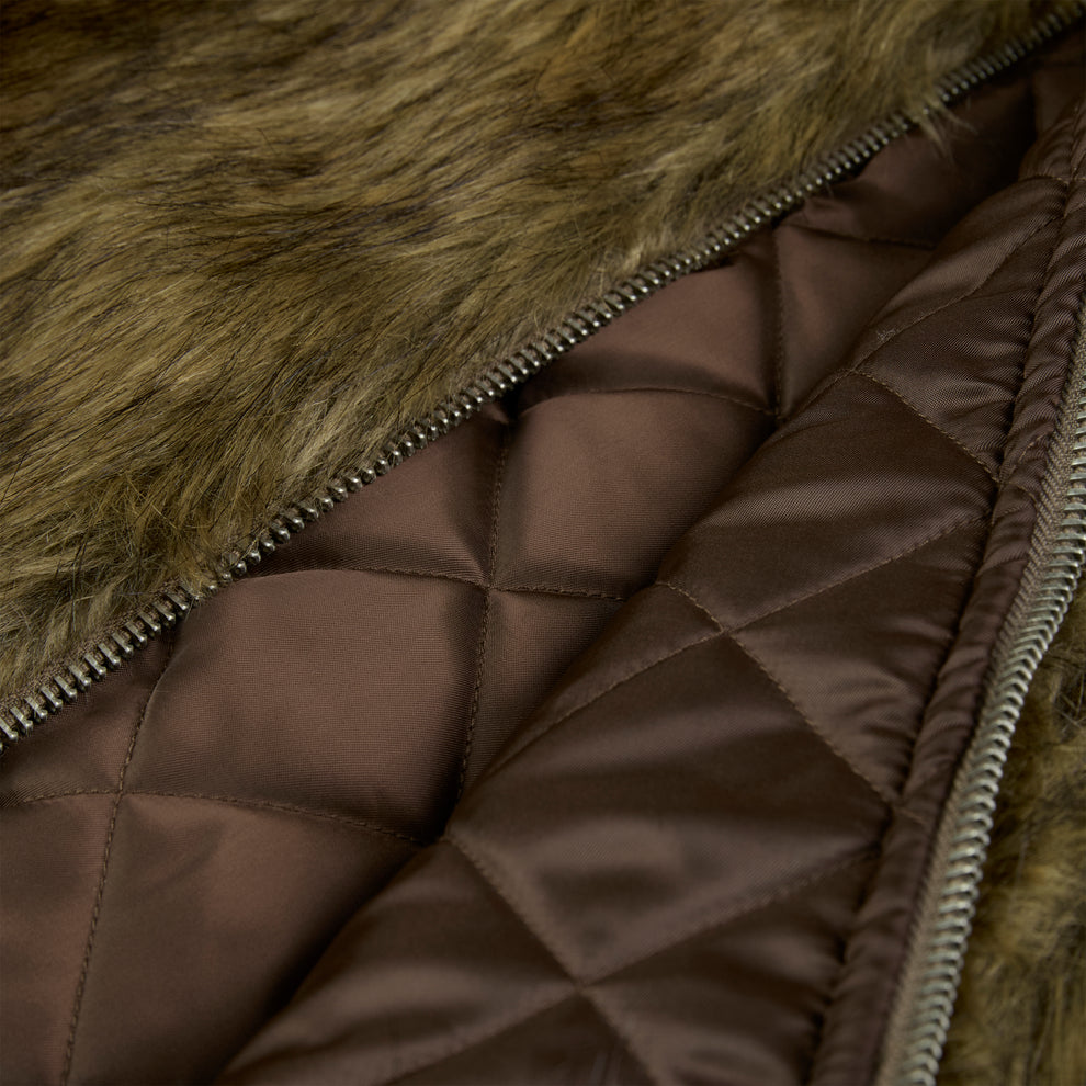 Brown faux fur jacket with a silver zipper and quilted satin lining.