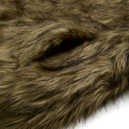Close-up of brown faux fur fabric with long, shaggy fibers, ideal for a hooded jacket.