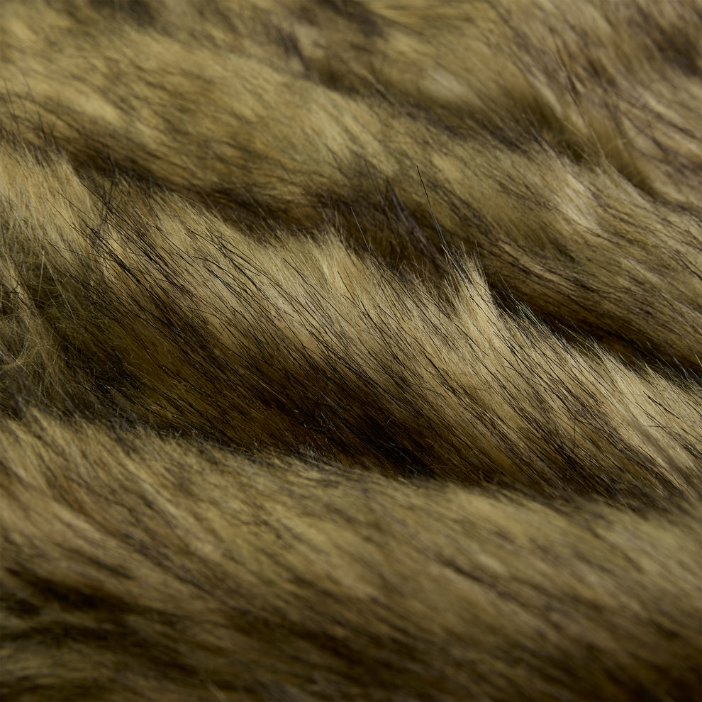 Close-up of brown and black faux fur, showing soft, textured fibers.