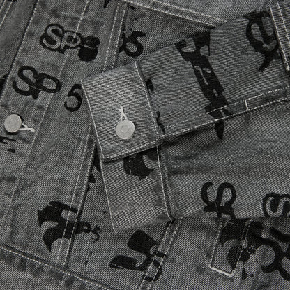 Gray denim trucker jacket with black all-over print, silver buttons, and red contrast stitching.