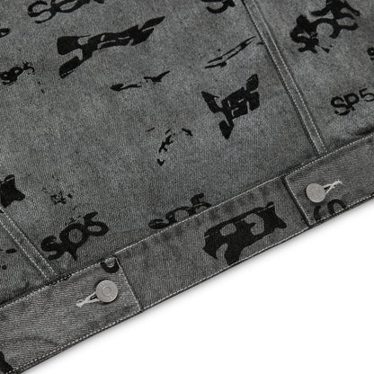 Gray denim trucker jacket with all-over black foil print and silver button closures.