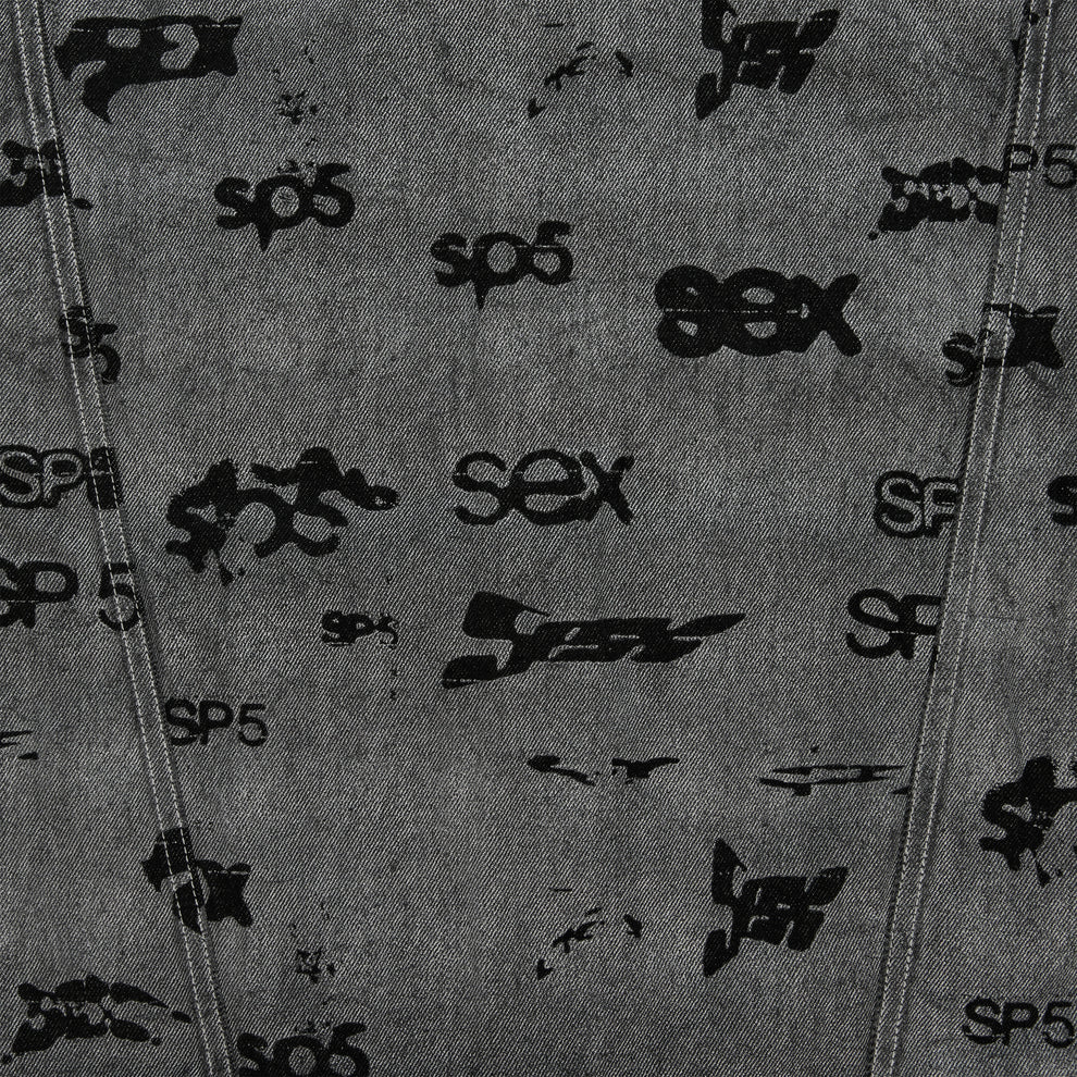 Gray denim trucker jacket with black all-over print design and red contrast stitching.