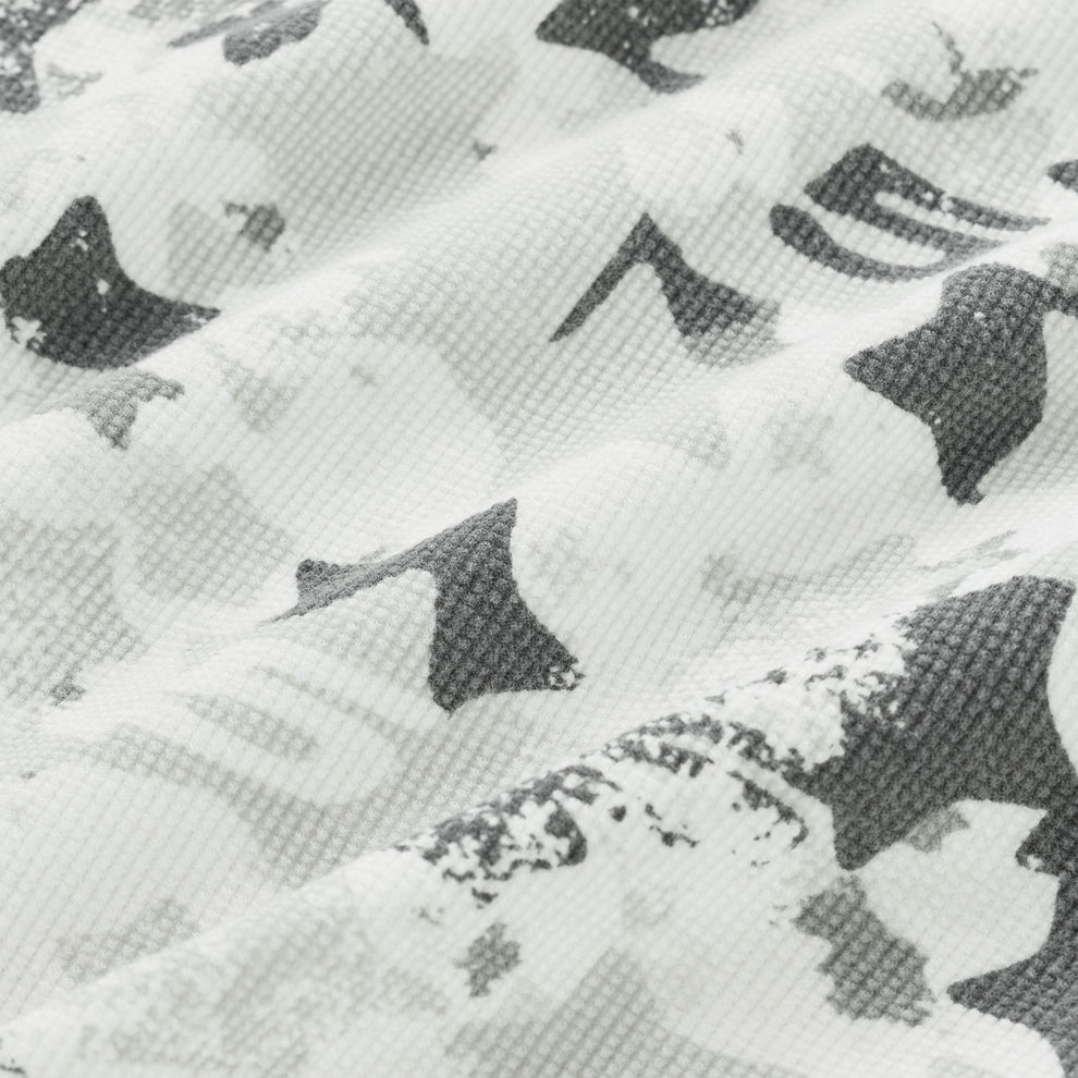 BELUGA AOP Thermal: White waffle knit fabric with all-over gray star camo print.