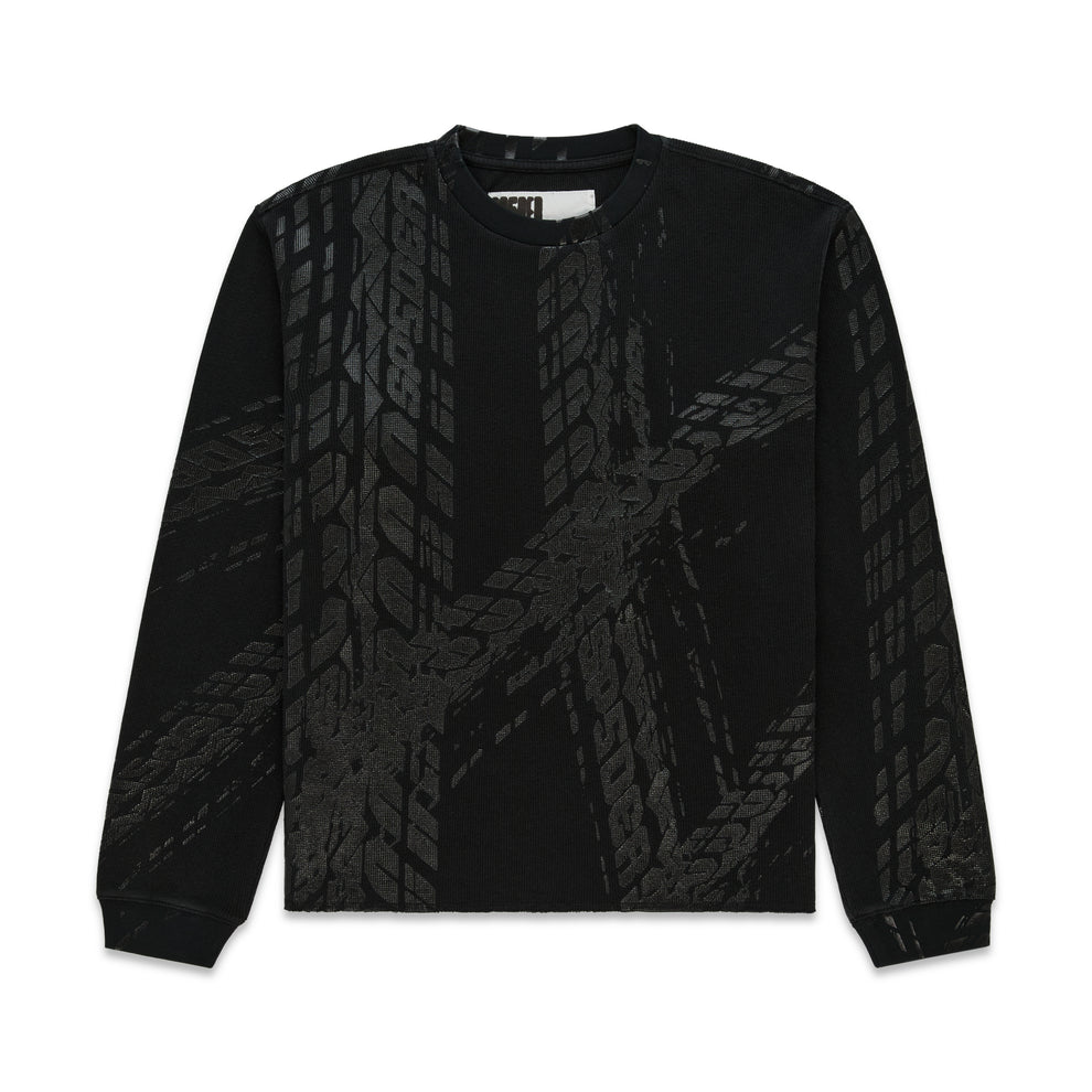 Black waffle knit thermal with ribbed collar, hem, and cuffs, featuring an all-over tire track print.