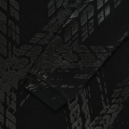 Black waffle knit thermal with subtle tire track print, ribbed cuff.