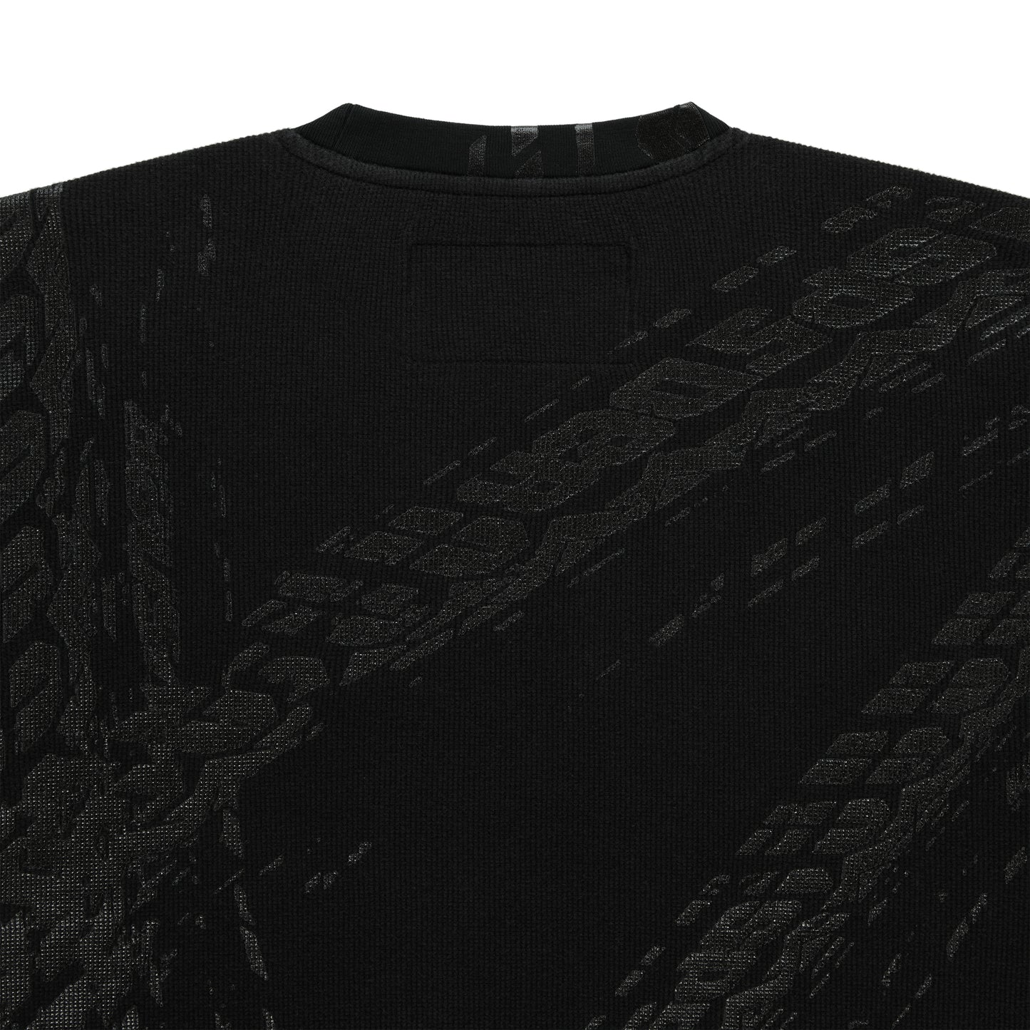 Black waffle knit thermal with ribbed collar and subtle tire track print.