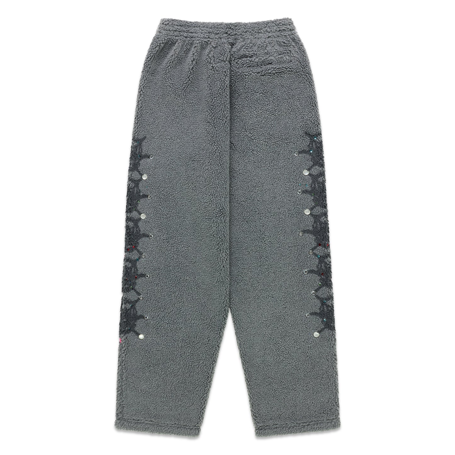 Gray sherpa fleece pants with web print and rhinestone embellishments down both legs.