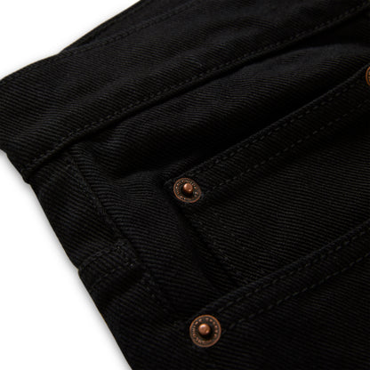 Black denim pant with custom branded copper hardware and belt loops.