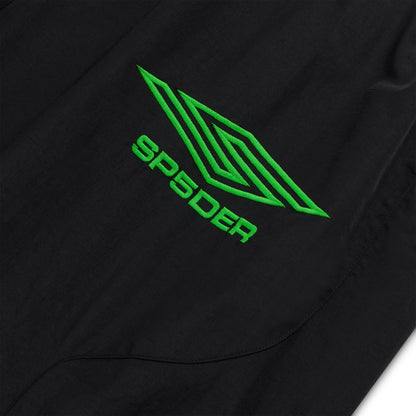 Black nylon track pant with green embroidered SP5DER logo and geometric graphic.