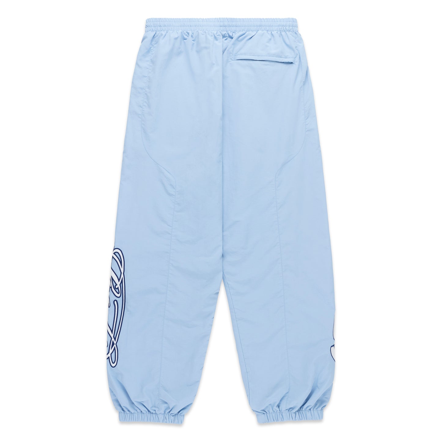 Light blue nylon track pants with paneled construction, elasticized cuffs, and embroidered graphic detailing.