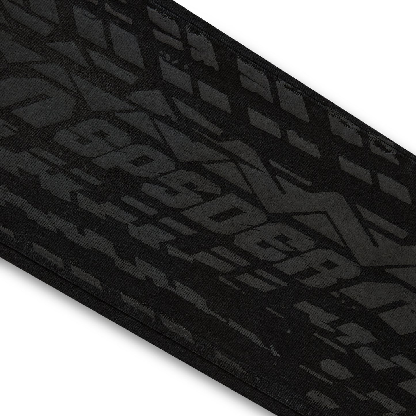 Black denim pant with all-over dark gray tire track design.