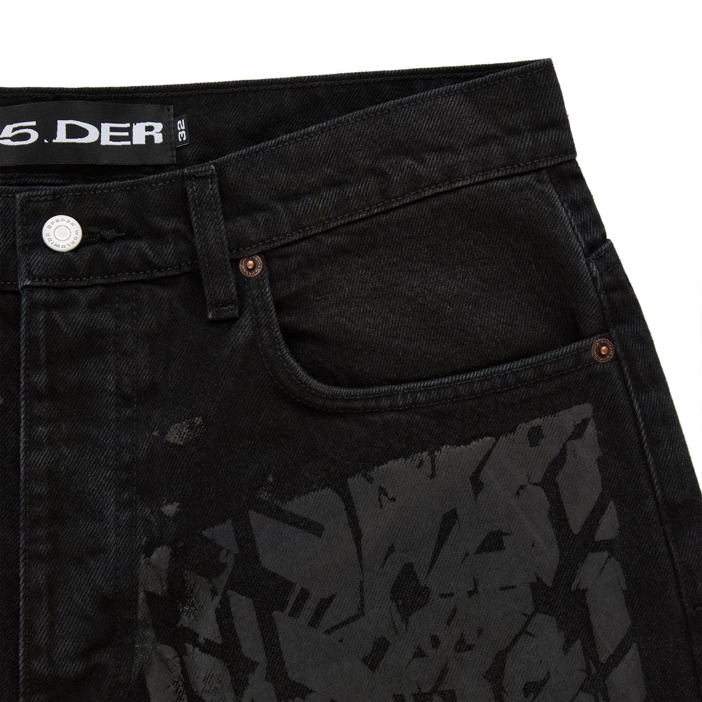 Black denim pants with all-over tire track design, custom hardware, and belt loops.