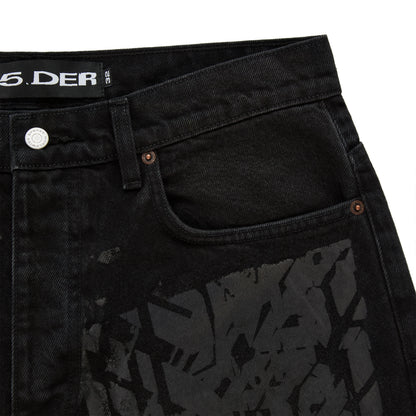 Black denim pants with all-over tire track design, custom hardware, and belt loops.