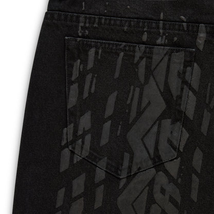 Black denim pant with all-over tire track design, custom hardware, and a back pocket.