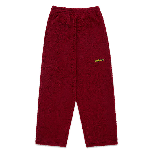 Red teddy fleece pant with elasticized waistband and yellow Sp5der logo.