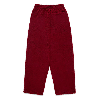 Red teddy fleece pant with elasticized waistband and straight leg fit.