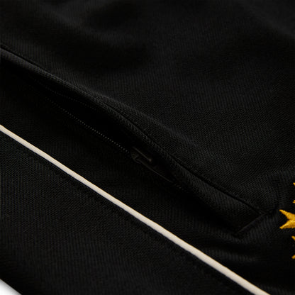 Black polyester Atlanta Track Pant with white side piping and a zippered pocket.