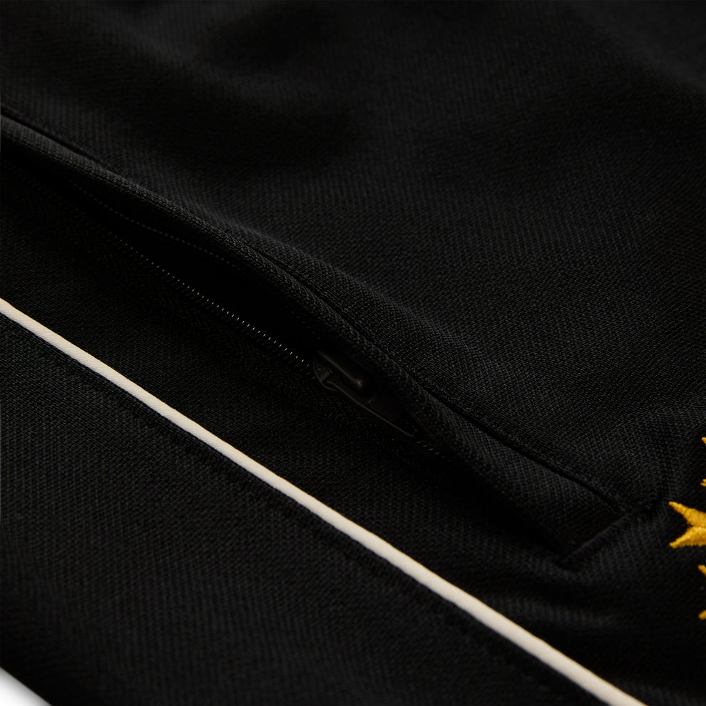 Black polyester Atlanta Track Pant with white side piping and a zippered pocket.