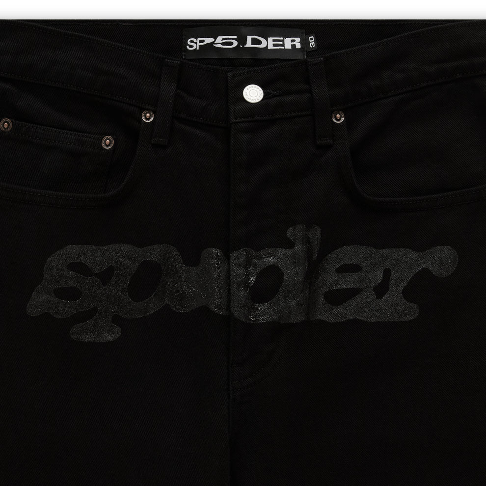 Black V3 DENIM pants with printed V3 logo at crotch, custom hardware, and five-pocket styling.
